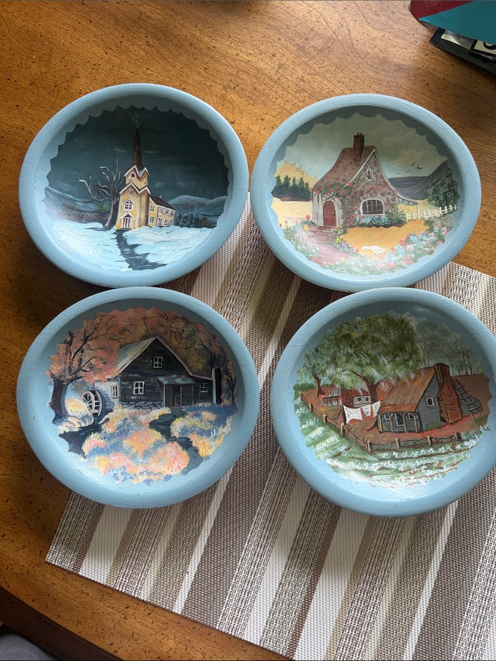 Set of Four Hand-Painted Wooden Village Plates in Light Blue